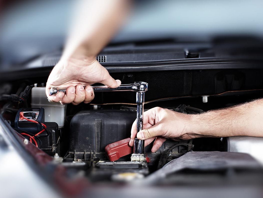 Mechanic using a spanner