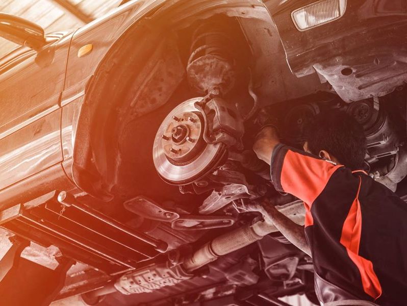 Mechanic repairing car